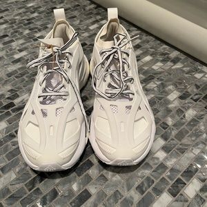 These white Adidas  sneakers by Stella McCartney are a Size 8.
